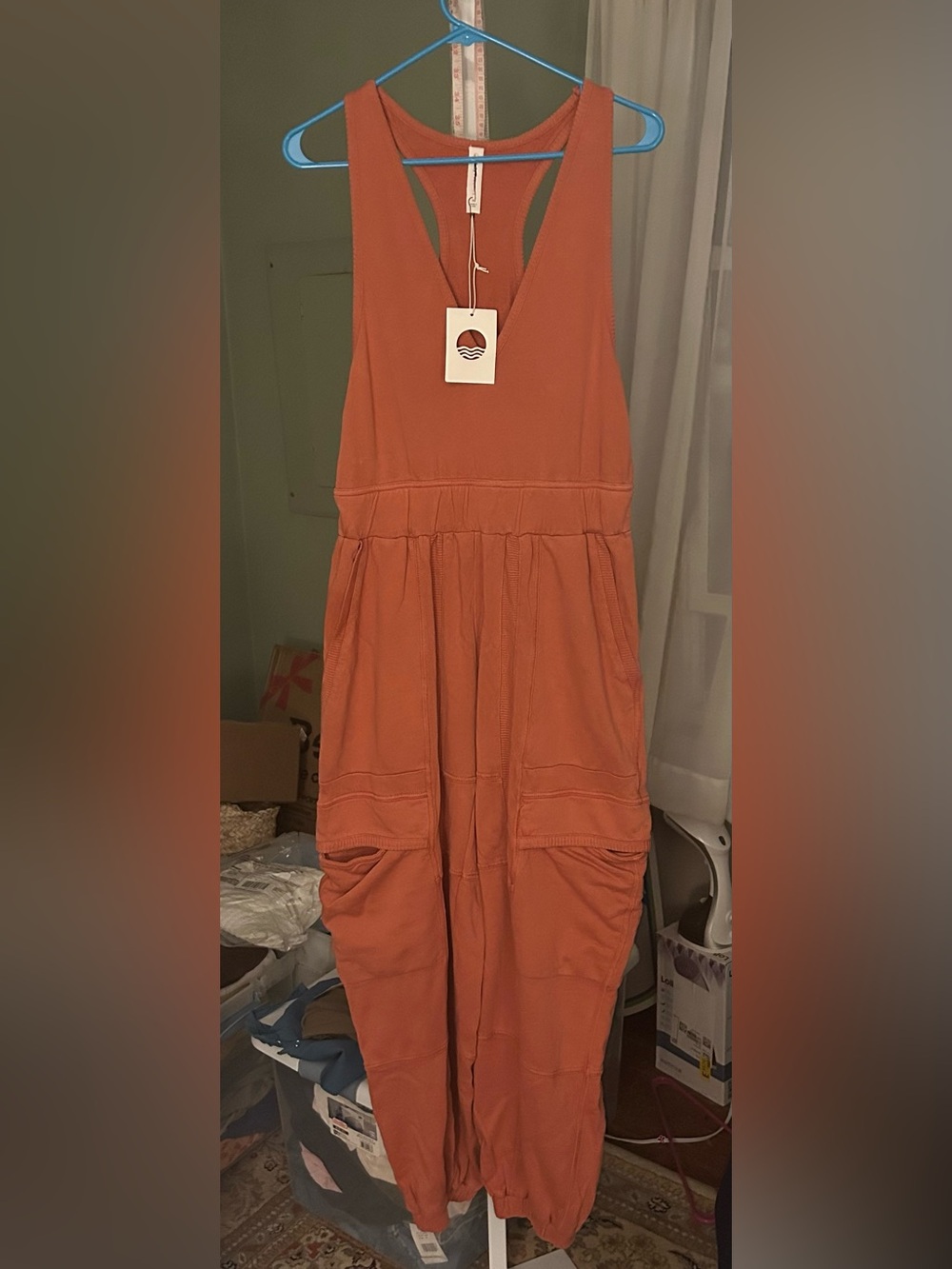 Anthropologie Daily Practice Cloud Rest Jumpsuit in warm orange color